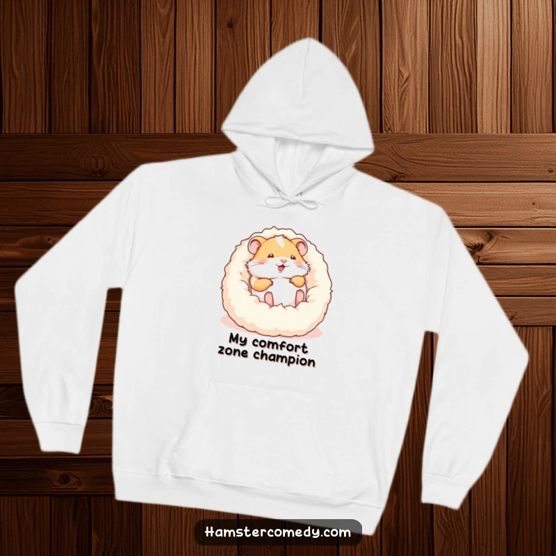 Funny hoodie depicting a delighted hamster in the midst of a joyful roll within a soft, fluffy bed, full of energy.